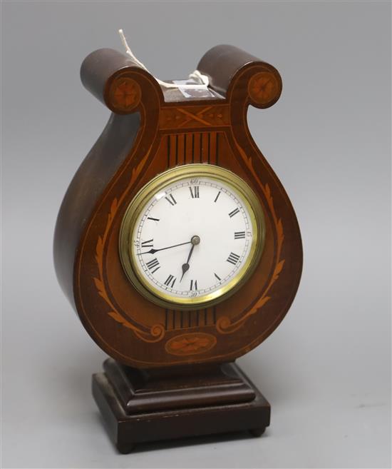 An Edwardian inlaid mahogany lyre shaped mantel timepiece H.26cm